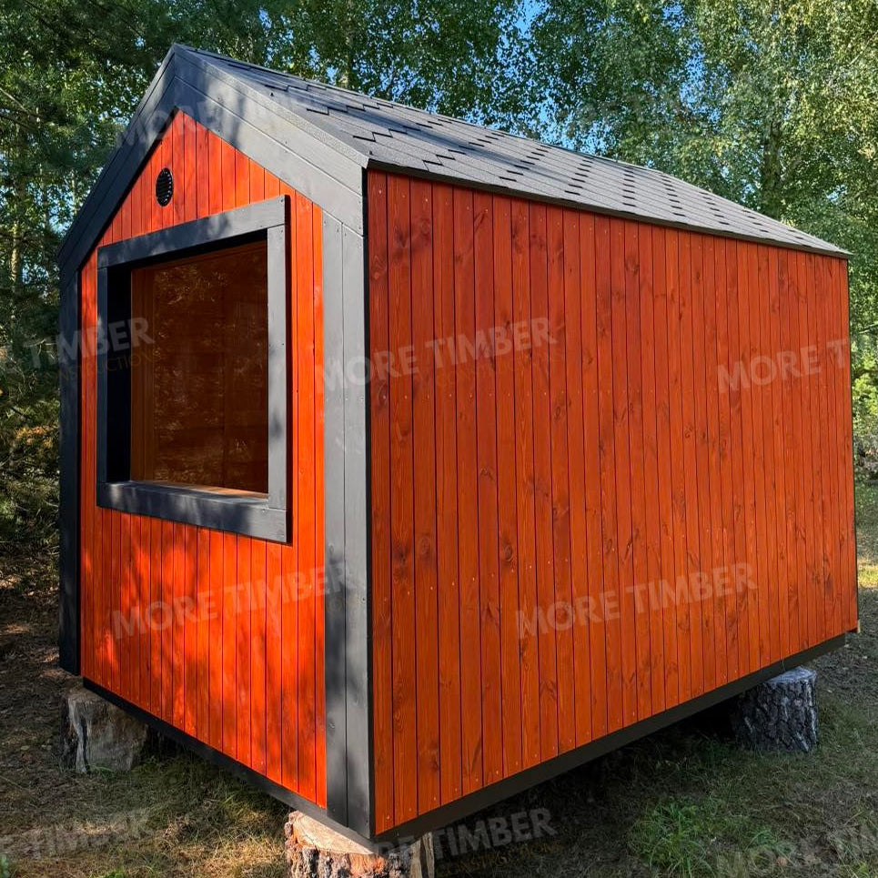 Wooden sauna with 'More Timber' branding, featuring wooden benches and a door.
