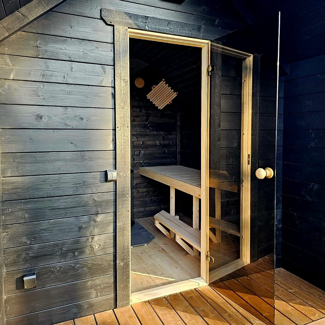 Family-sized traditional sauna with linden benches and terrace