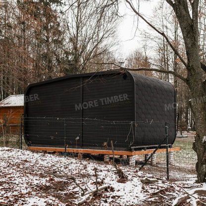 Sauna and hot tub surrounded by lush greenery