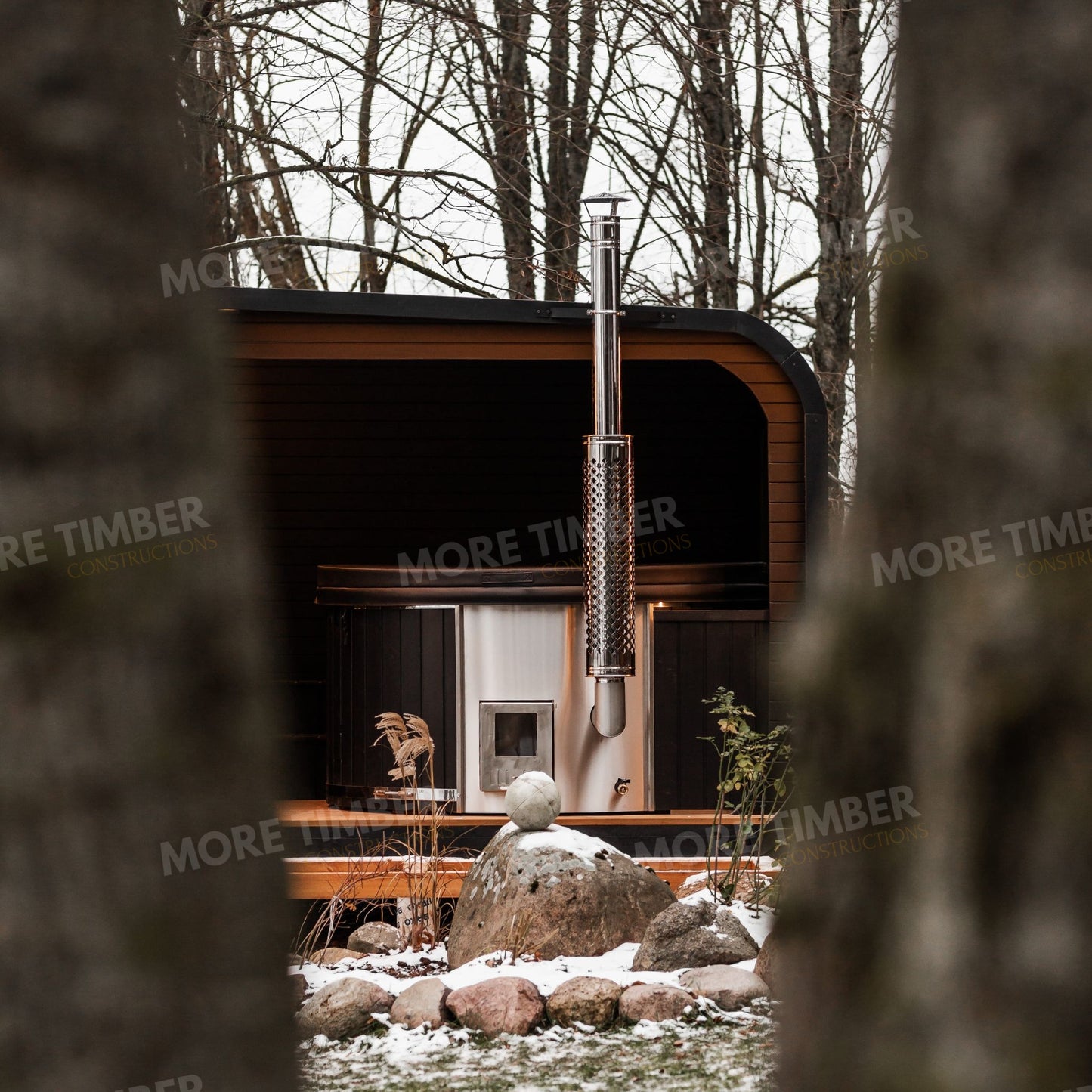 Traditional Finnish sauna with outdoor wooden hot tub