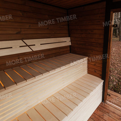 Natural wood sauna with glass door and subtle steam