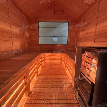 Wooden sauna with 'More Timber' branding, featuring wooden benches and a door.