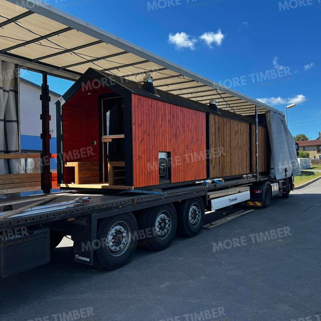 Wooden sauna with 'More Timber' branding, featuring wooden benches and a door.