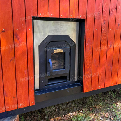 Wooden sauna with 'More Timber' branding, featuring wooden benches and a door.