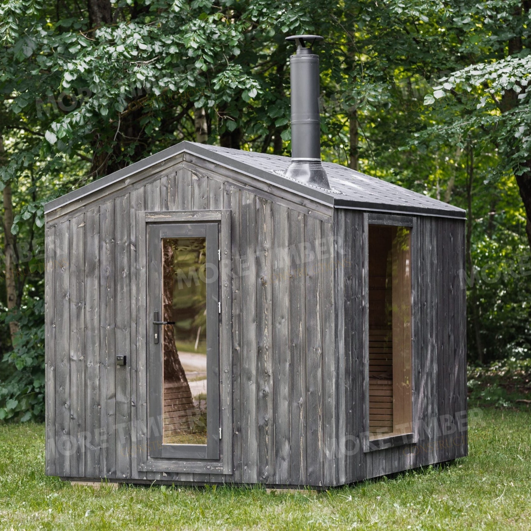 Warm wooden sauna with bucket and ladle on bench