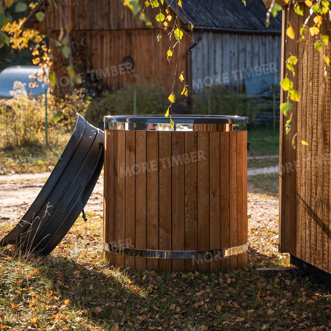 Wooden sauna with 'More Timber' branding, featuring wooden benches and a door.