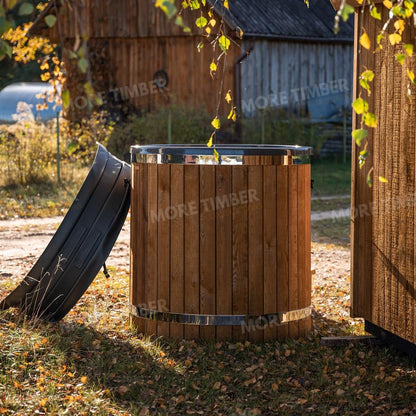 Wooden sauna with 'More Timber' branding, featuring wooden benches and a door.