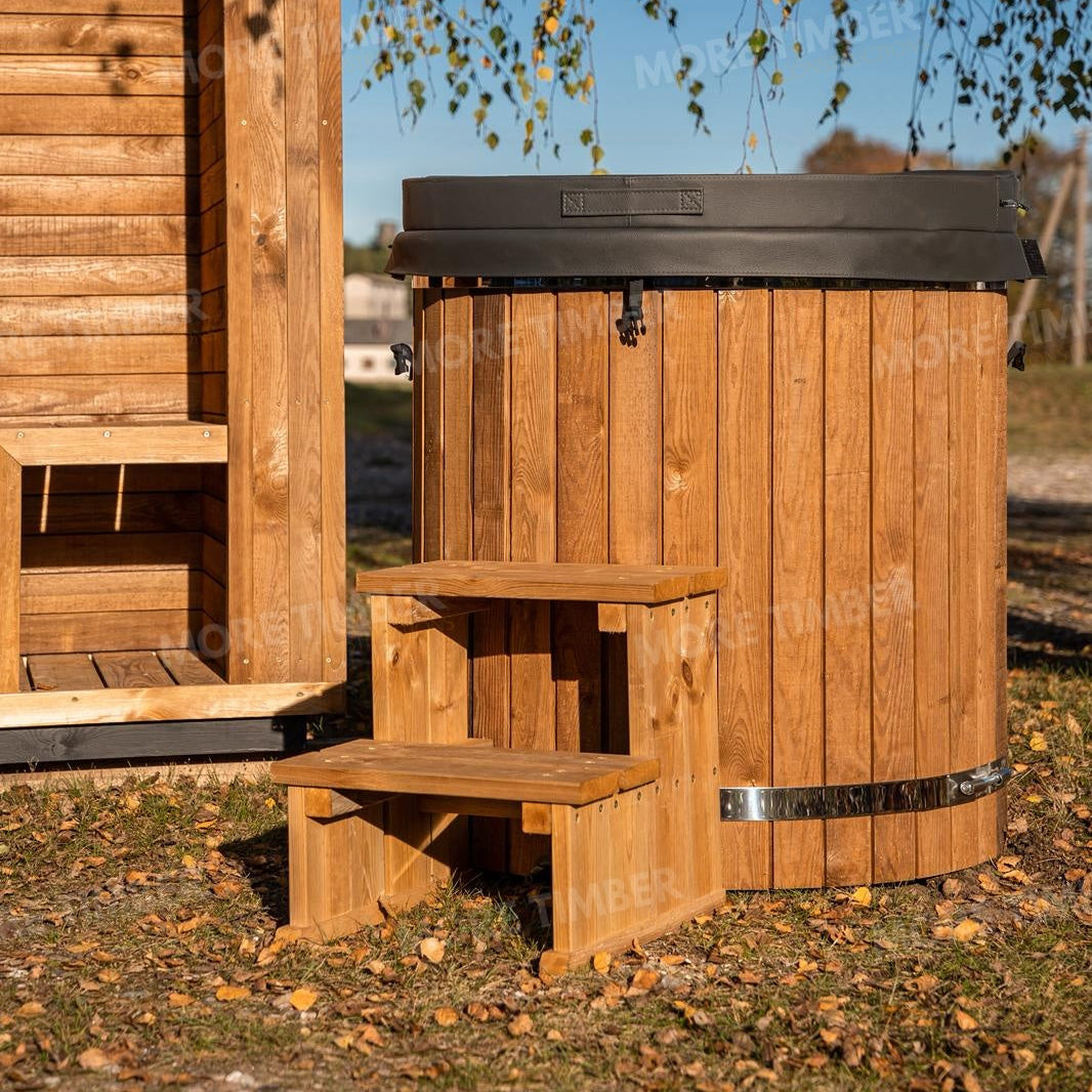 Wooden sauna with 'More Timber' branding, featuring wooden benches and a door.