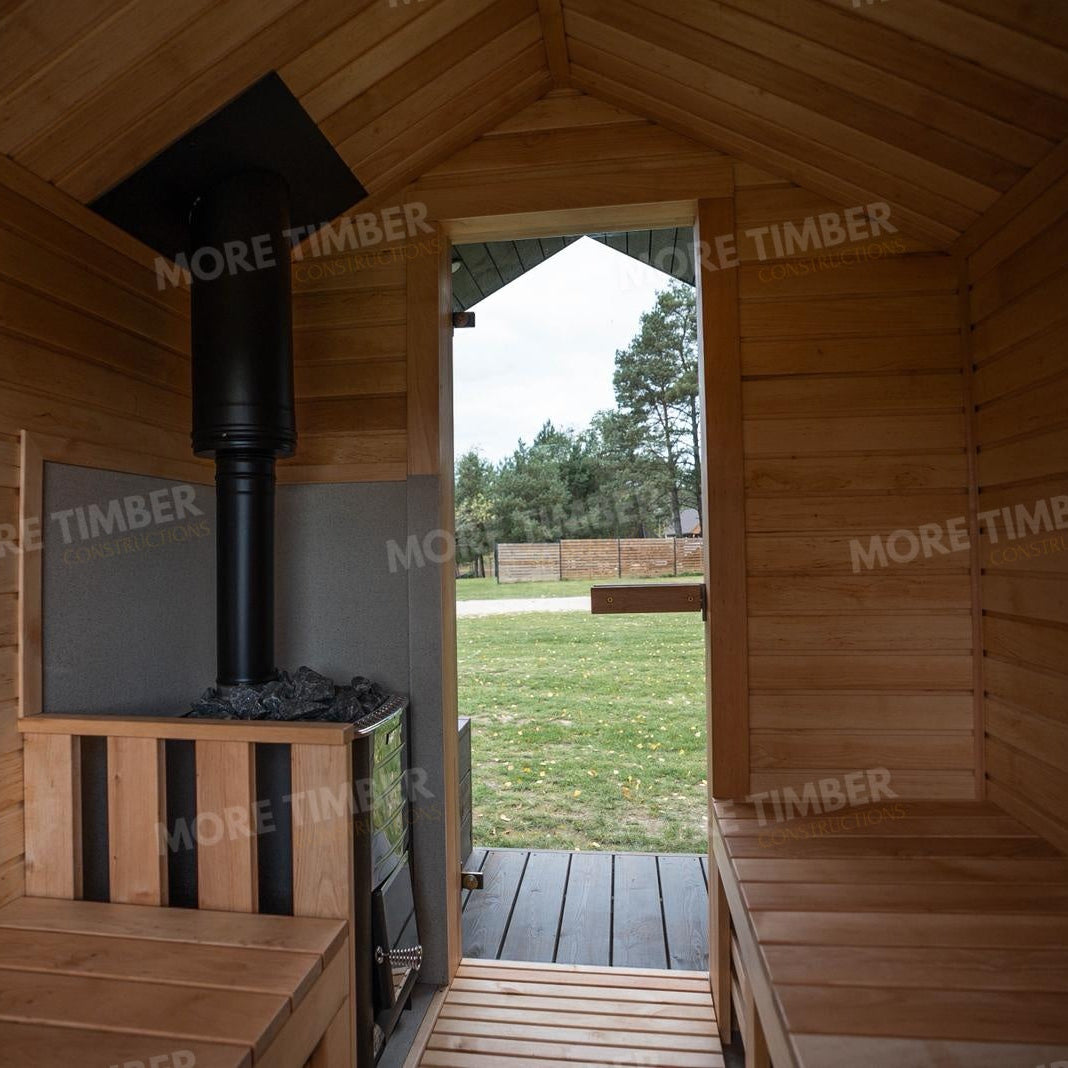Wooden sauna with 'More Timber' branding, featuring wooden benches and a door.