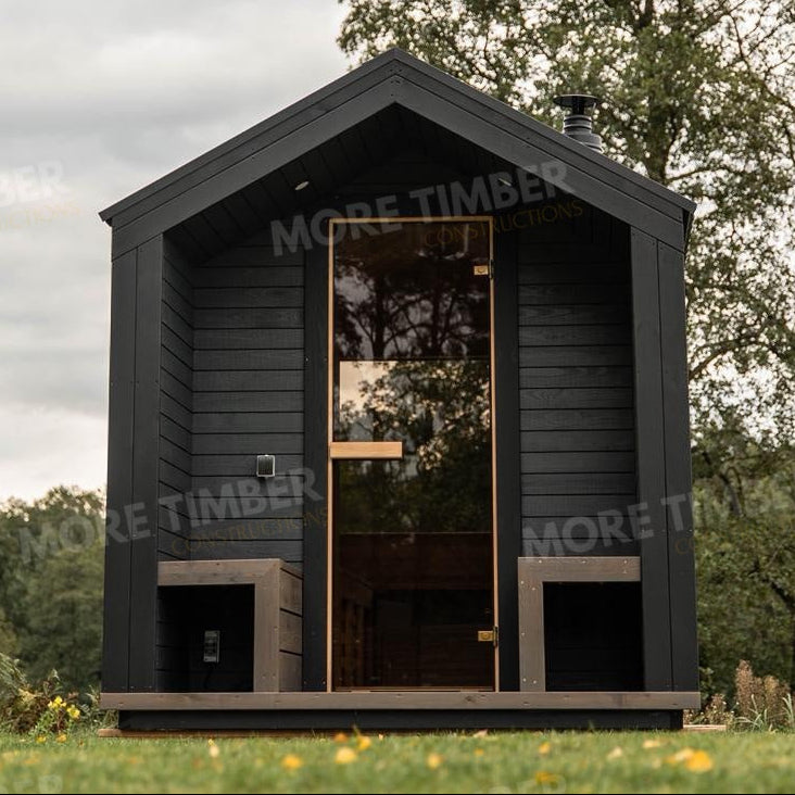 Wooden sauna with 'More Timber' branding, featuring wooden benches and a door.