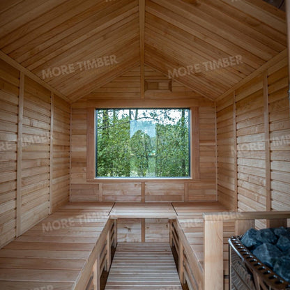 Wooden sauna with 'More Timber' branding, featuring wooden benches and a door.