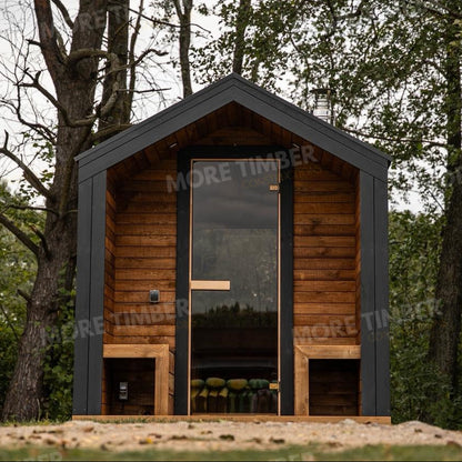 Wooden sauna with 'More Timber' branding, featuring wooden benches and a door.