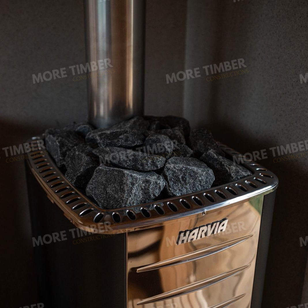 Wooden sauna with 'More Timber' branding, featuring wooden benches and a door.