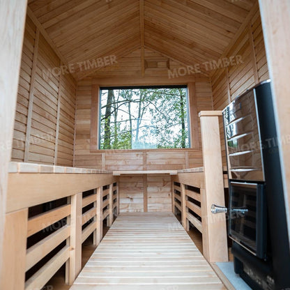 Wooden sauna with 'More Timber' branding, featuring wooden benches and a door.