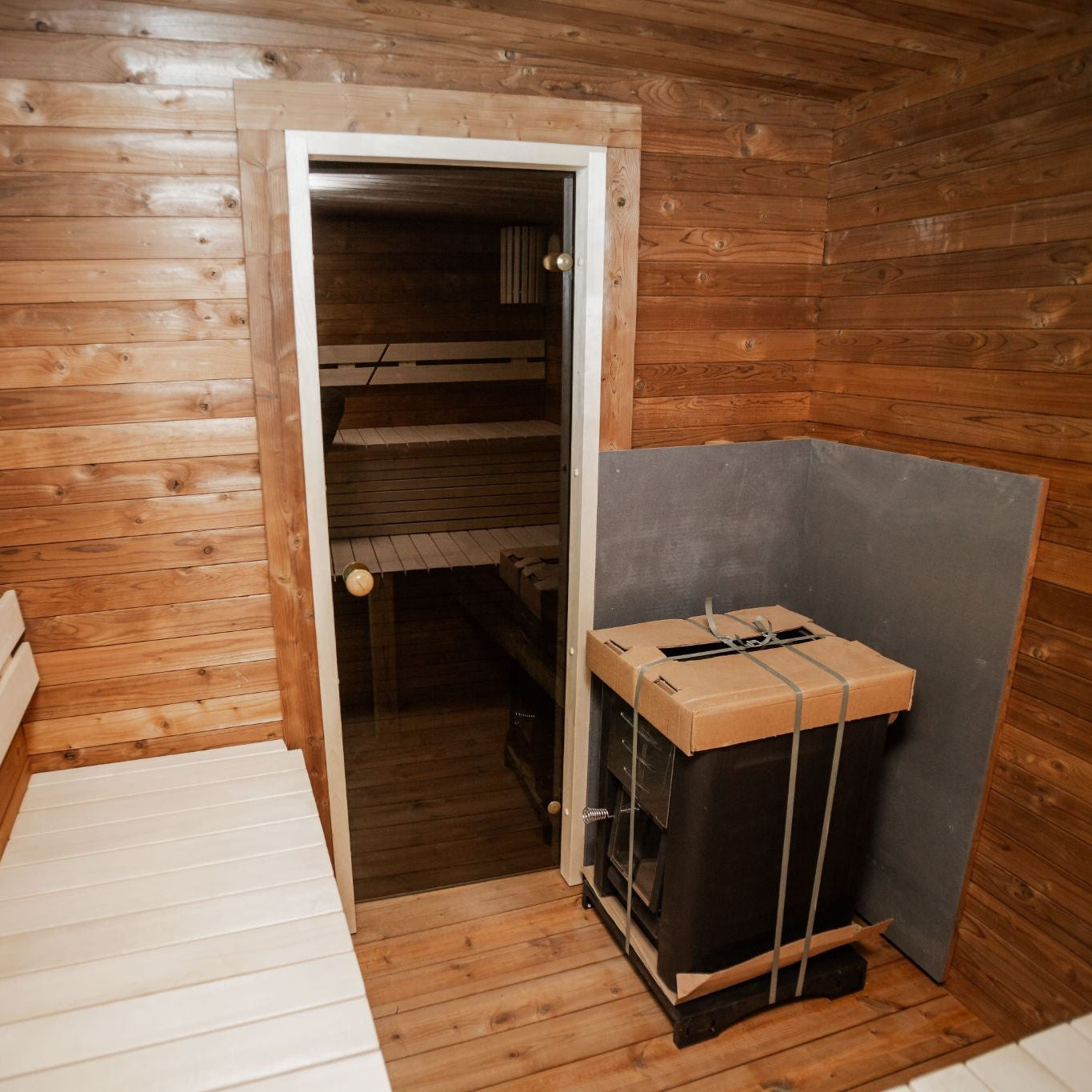 Thermowood sauna exterior with 44 mm walls and bitumen roof shingles