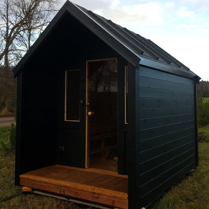 Traditional sauna cabin with terrace and gable roof design