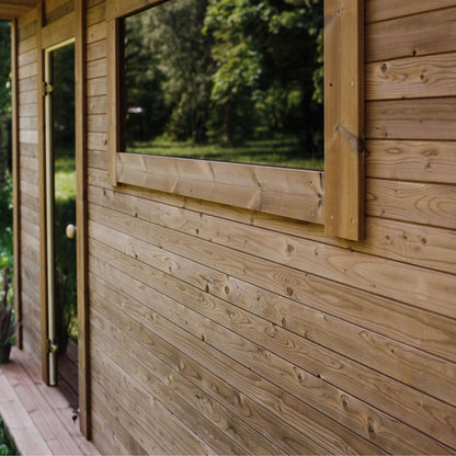 Comfortable pre-room sitting area inside the thermowood sauna