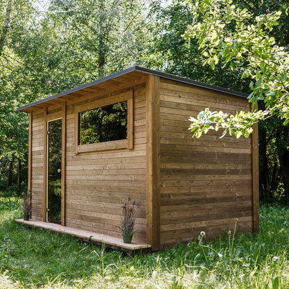 Sauna heater and bench area inside a thermowood cabin