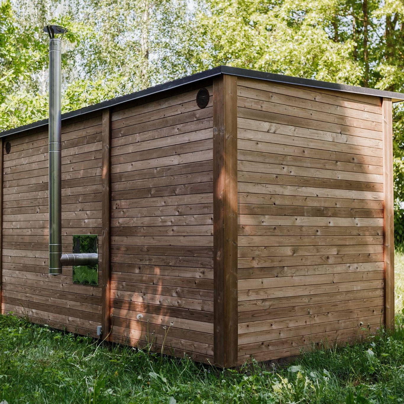 Sauna interior illuminated by Harvia lamps for a warm ambience